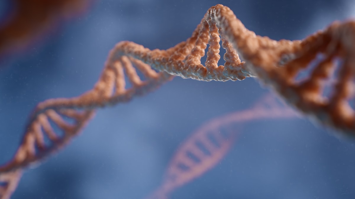 Biology textbook open to DNA double helix diagram