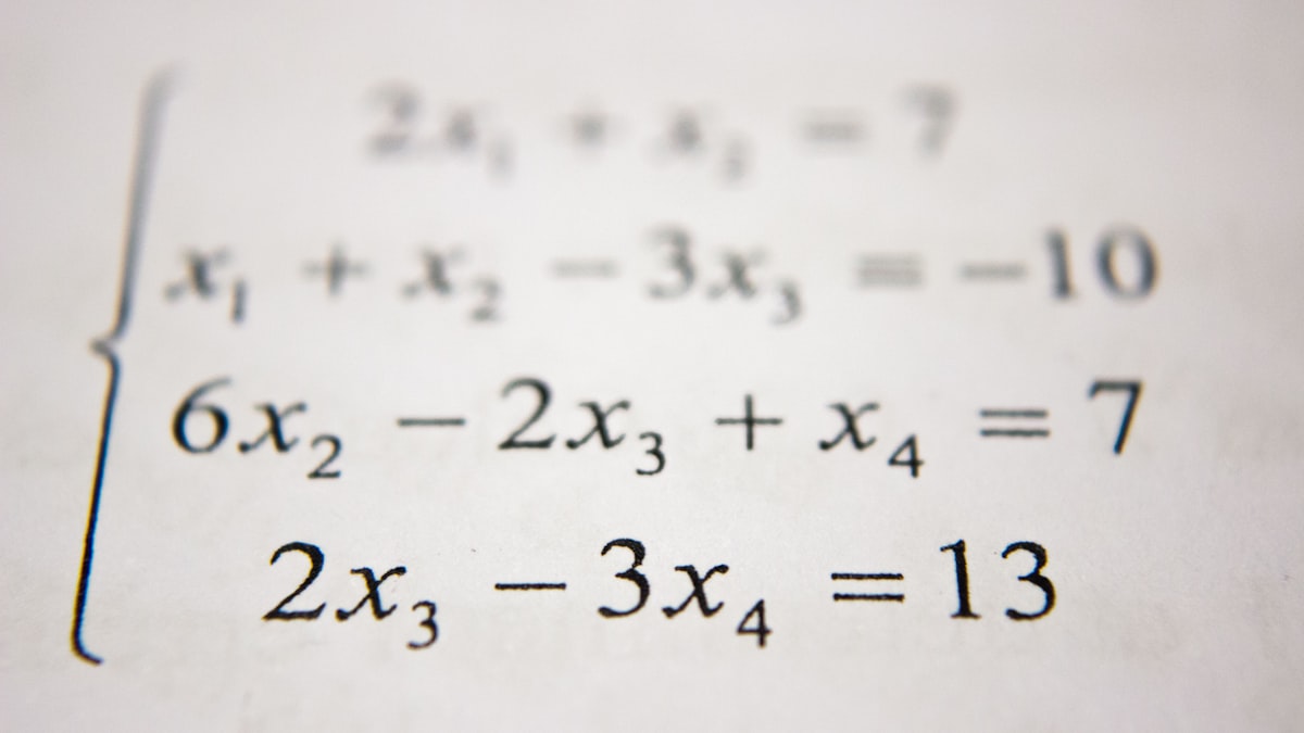 Calculus textbook open with mathematical equations and graphs