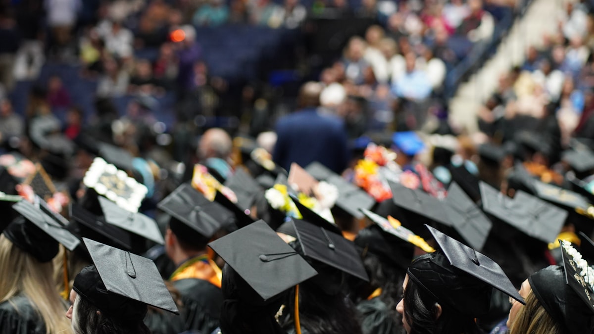 Student with diploma and graduation ceremony