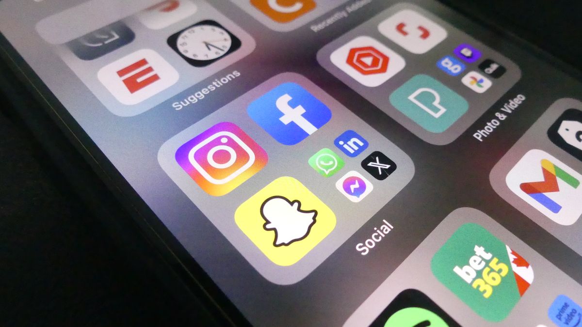 A phone showing social media hashtags