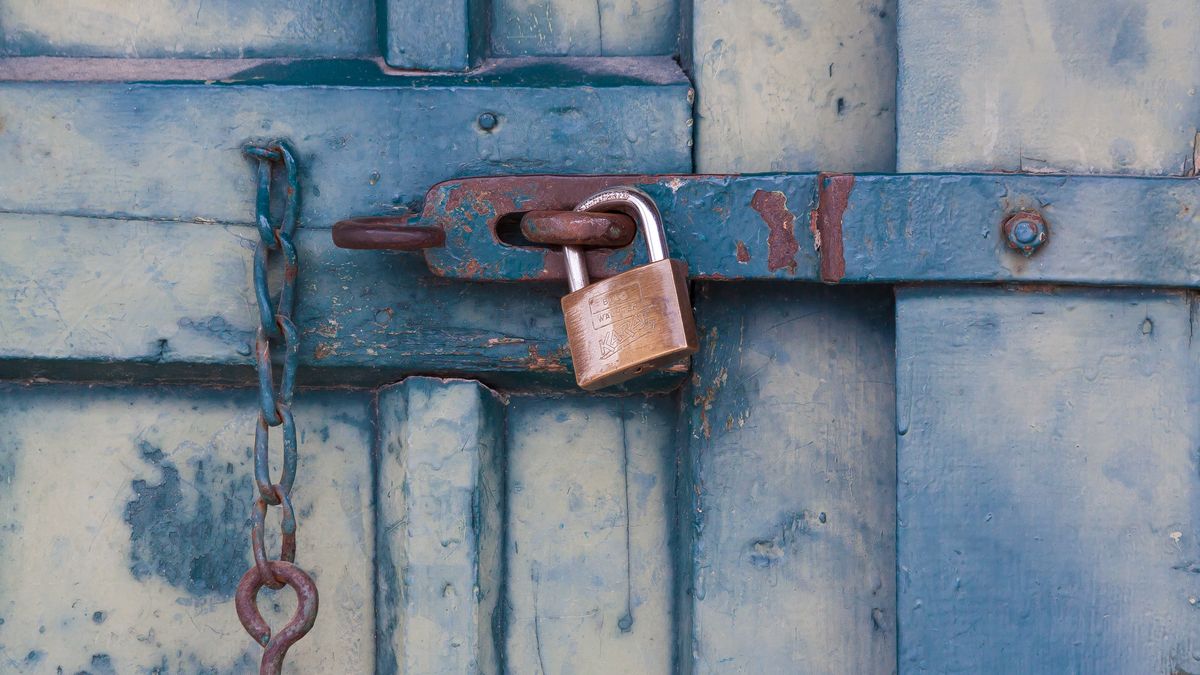 A padlock over a field of code