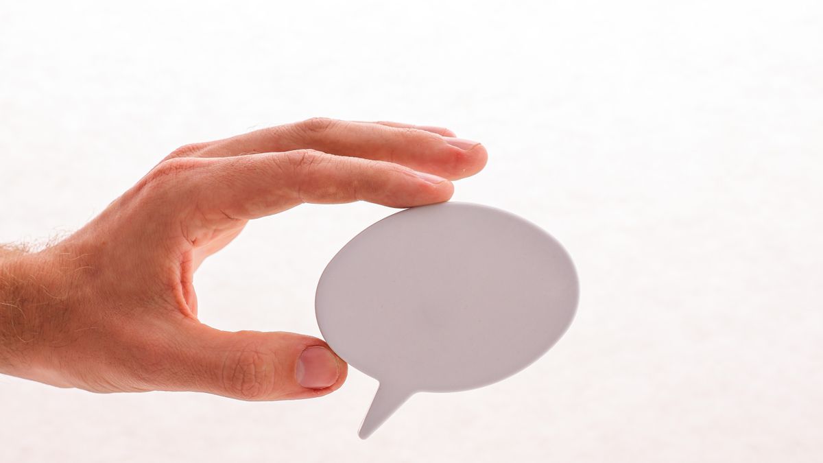 A white comic speech bubble over a photo