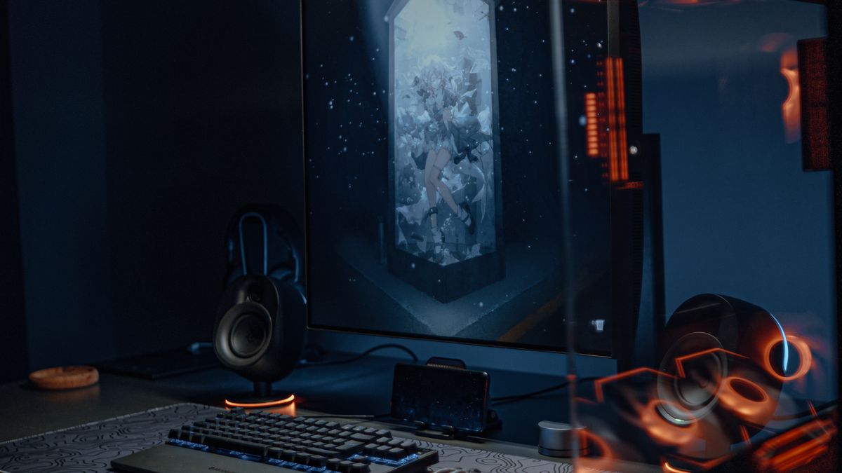 Game controller glowing on a dark desk setup