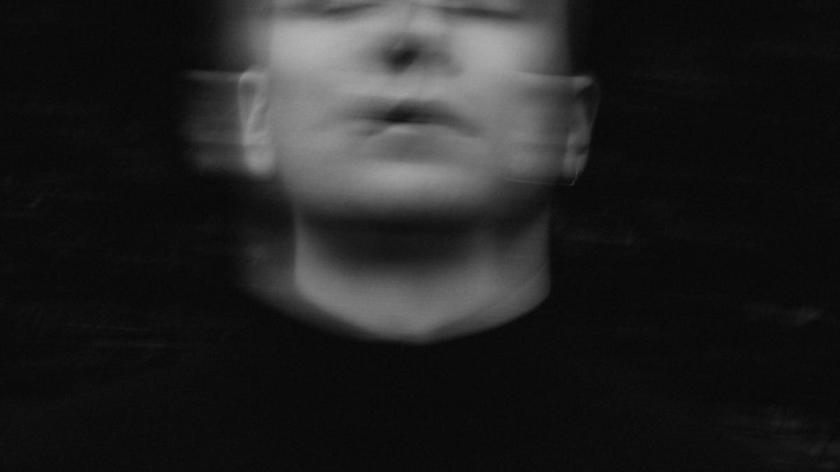 Glitchy distorted typography on a dark screen